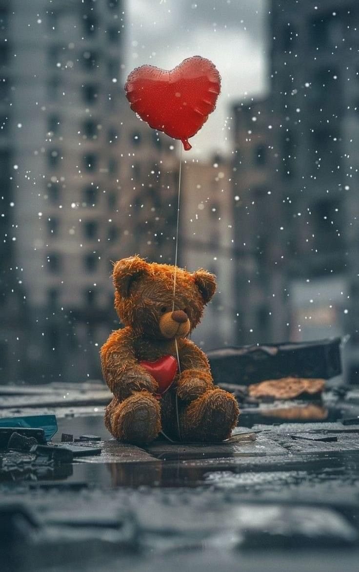 Teddy Bear Holding A Small Red Heart